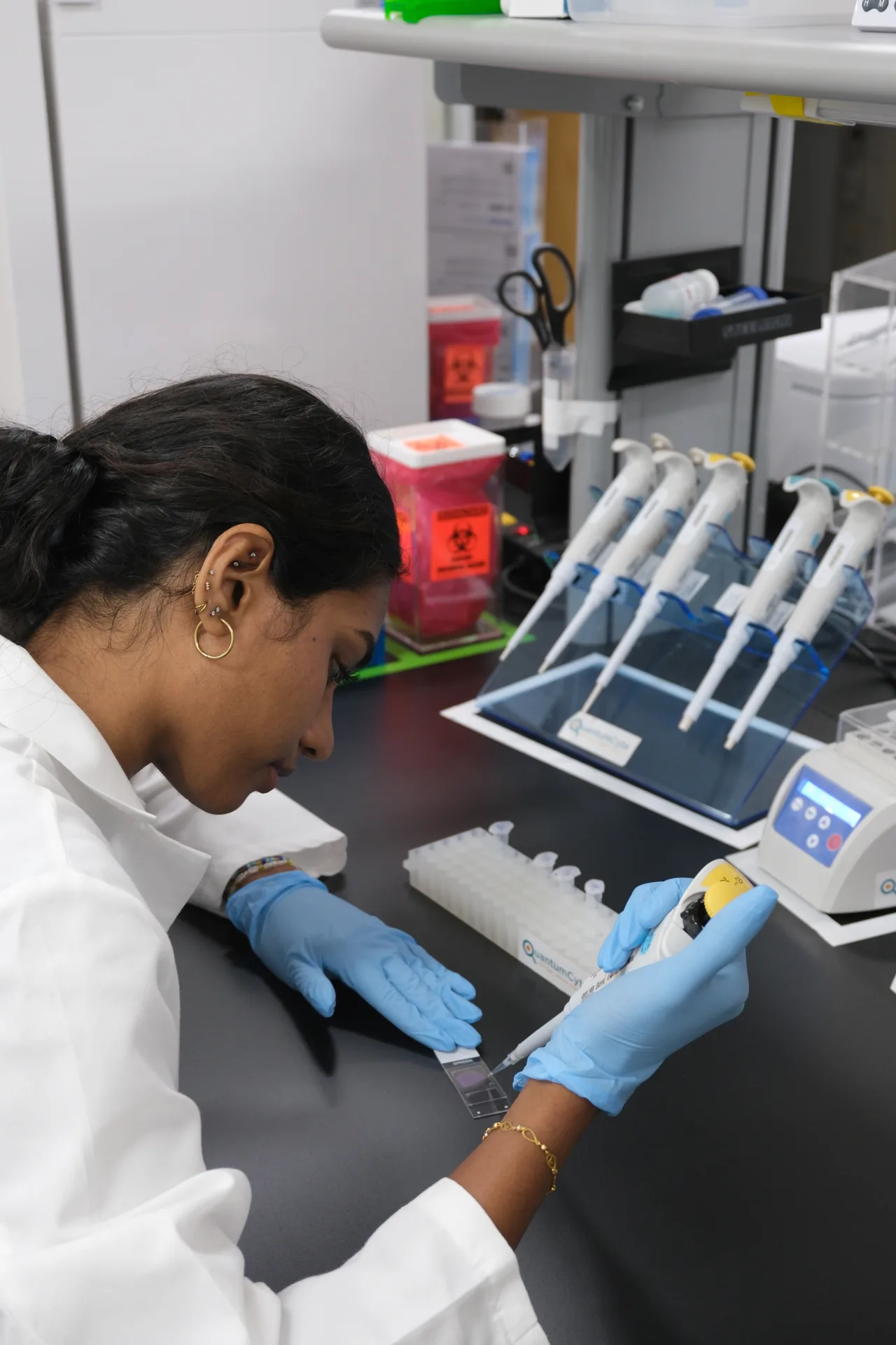 QuantumCyte scientist preparing samples in the lab